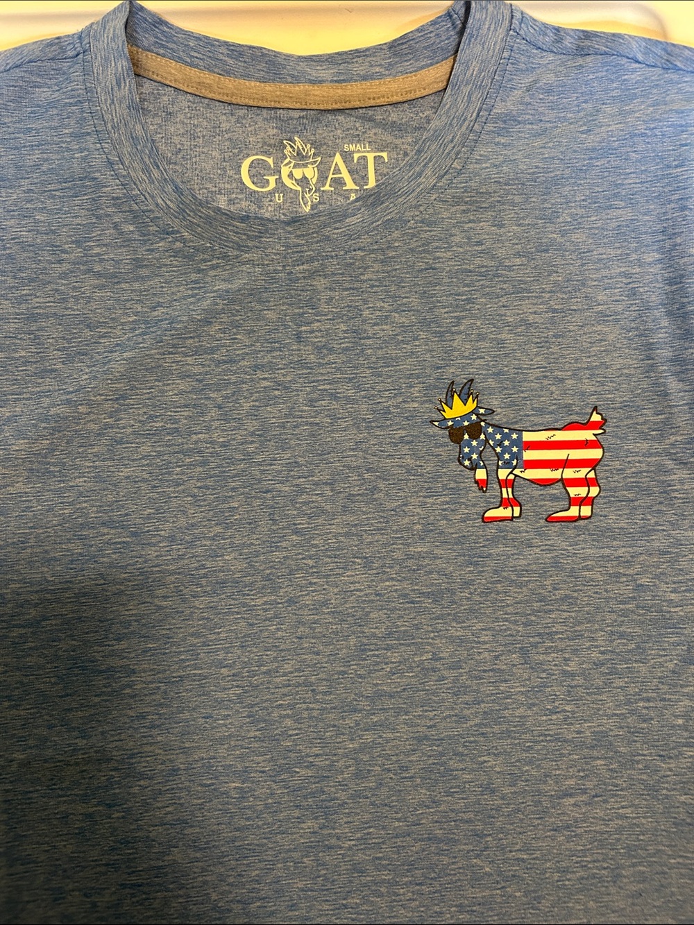 GOAT Short Sleeve Crewneck Tee in Heather Blue with Patriotic Goat Graphic